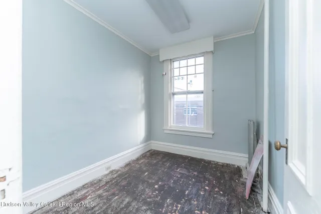 a view of an empty room and window