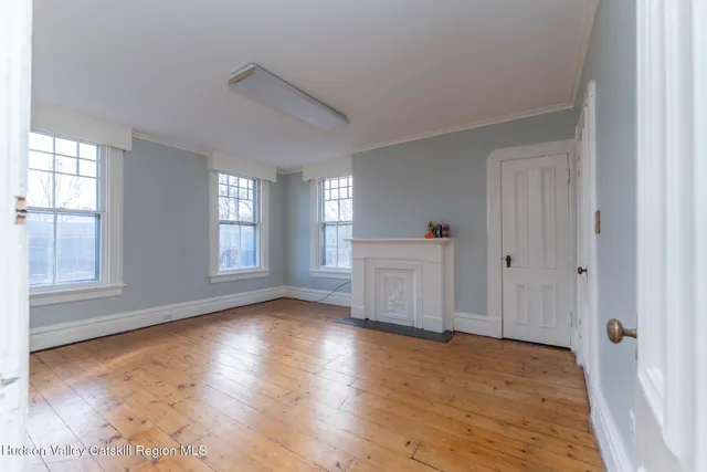 a view of an empty room and window