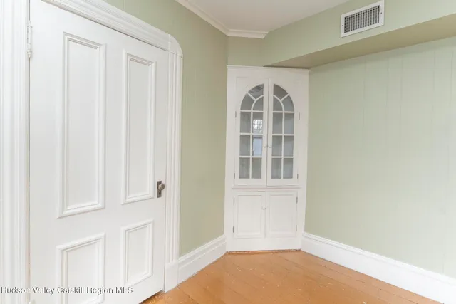 a bathroom with a granite countertop toilet a sink and a large mirror