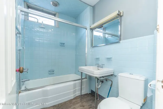 a kitchen with stainless steel appliances a refrigerator and a stove top oven