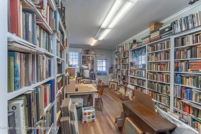 a view of living room and wooden floor
