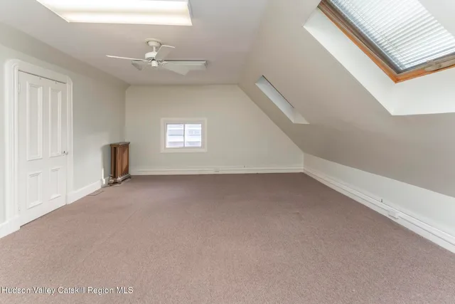 an empty room with windows and entrance