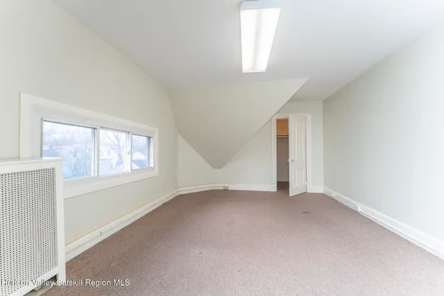 a view of a car park in front of house