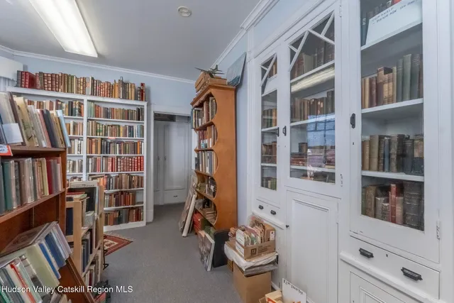 a bookshelf with wooden floor and book shelf