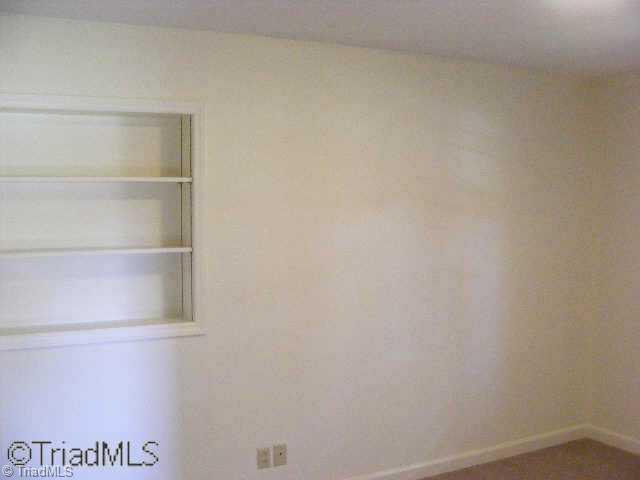 3301 Oak Ridge Road Summerfield, NC 27358 - Photo 3 of 8 Other. Bedroom showing fresh, neutral color paint and built-in shelves.