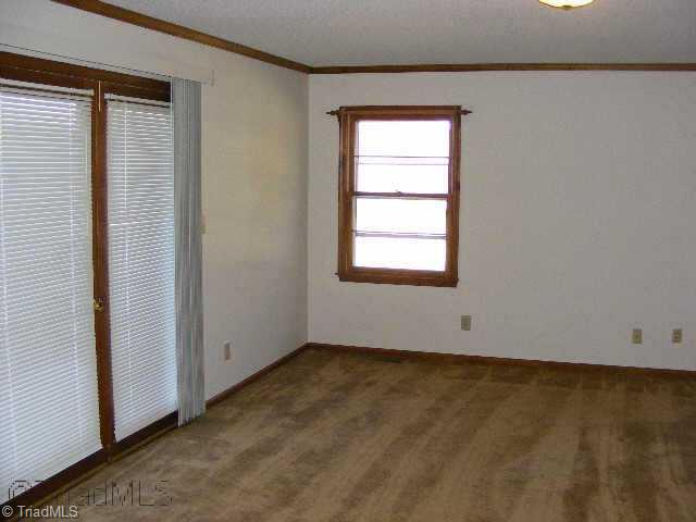 3301 Oak Ridge Road Summerfield, NC 27358 - Photo 8 of 8 Other. Master bedroom. Door leads to deck. Has nice view out windows to rear.