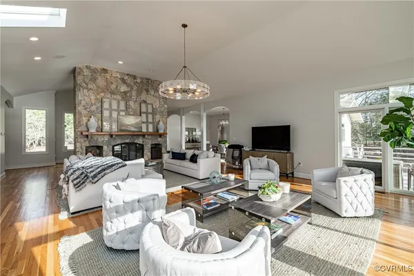 a kitchen with granite countertop a sink stove top oven and cabinets