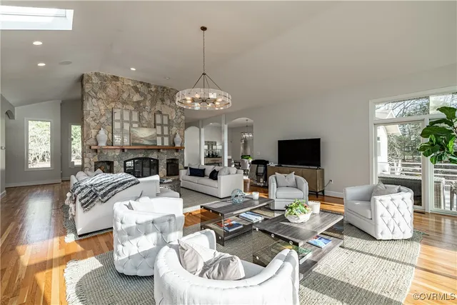 a kitchen with granite countertop a sink stove top oven and cabinets