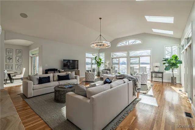 a kitchen a sink a counter and chairs
