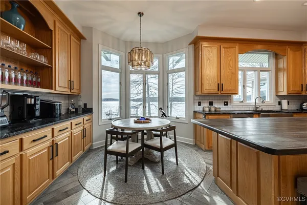 a bathroom with a granite countertop sink mirror and double