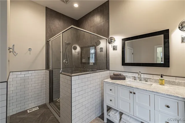 an aerial view of a house with garden space and street view