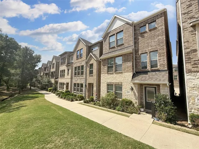 a view of a building with a yard