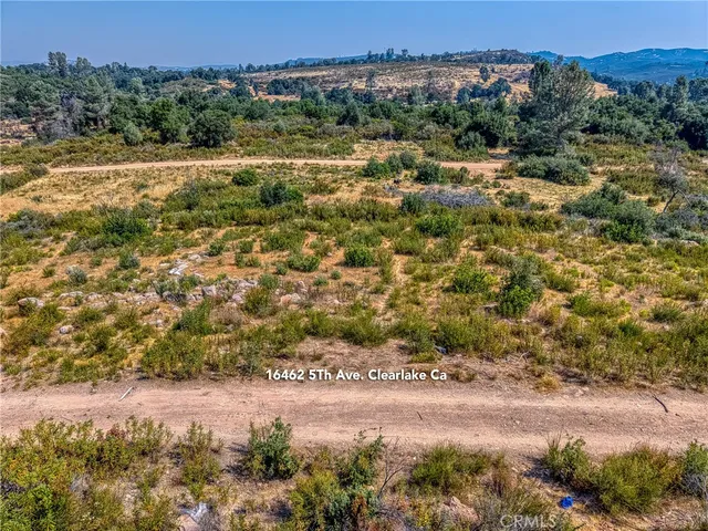 a view of a yard with a mountain
