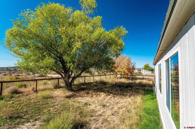 a view of swimming pool with a patio and a yard