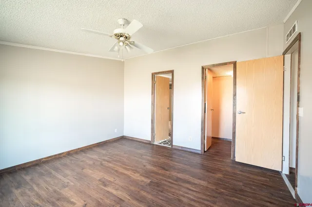 a view of a room with wooden floor