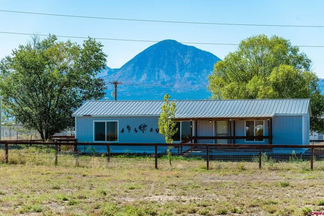 a house view with a swimming pool