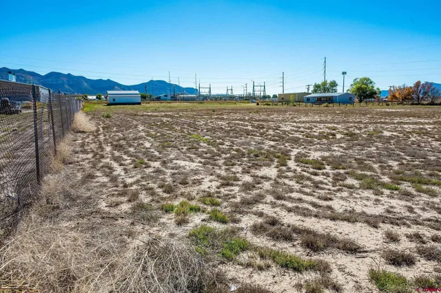 a view of a lake with houses in the back