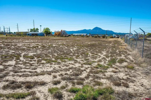 a view of a lake with houses in the background