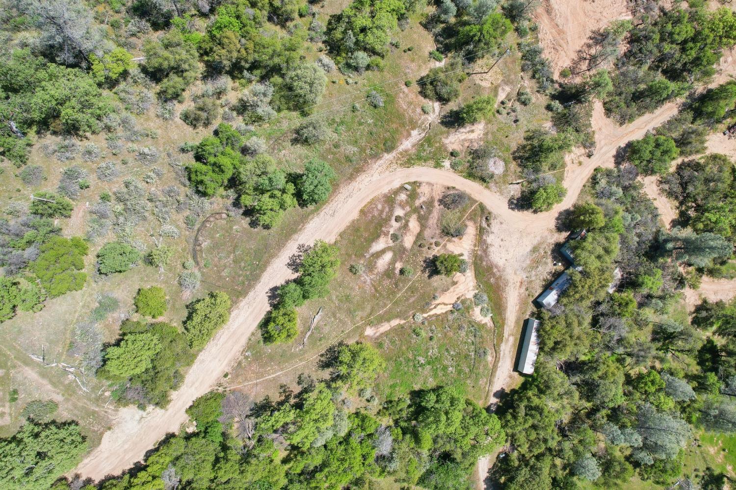 4522 Mystic Mine Road Somerset, CA 95684 - Photo 4 of 16 an aerial view of a house with a yard and flowers