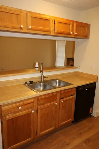 a kitchen with a sink and cabinets