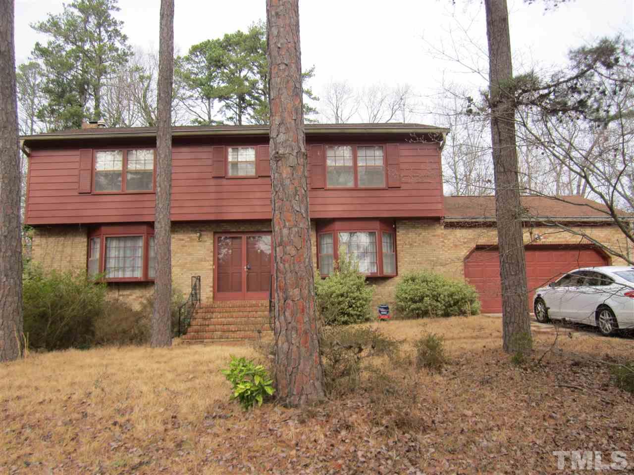 1401 Falls Church Road Raleigh, NC 27609 - Photo 1 of 11 a front view of a house with a yard