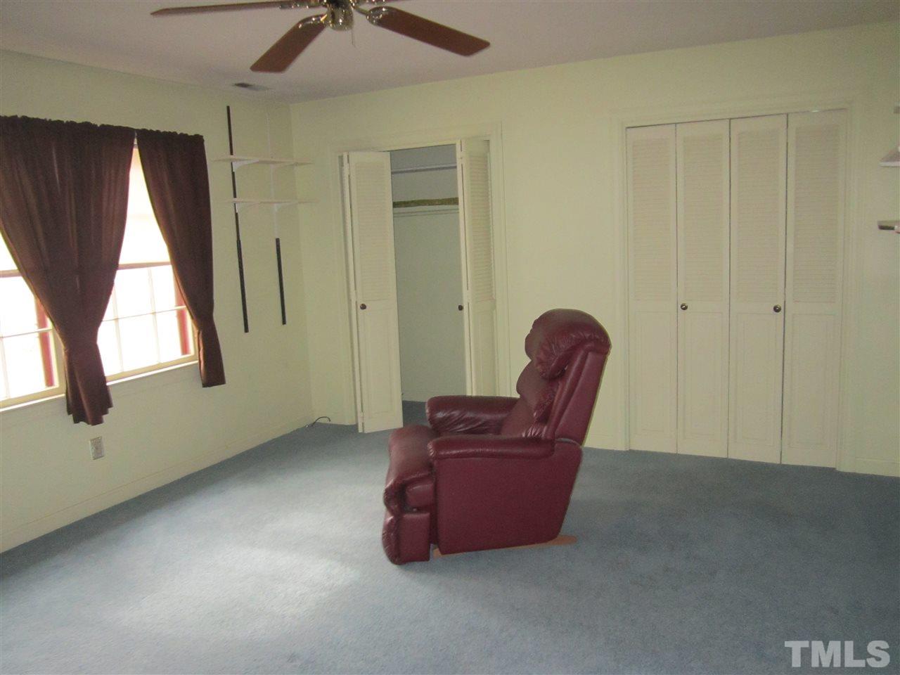 1401 Falls Church Road Raleigh, NC 27609 - Photo 6 of 11 a living room with furniture and a window