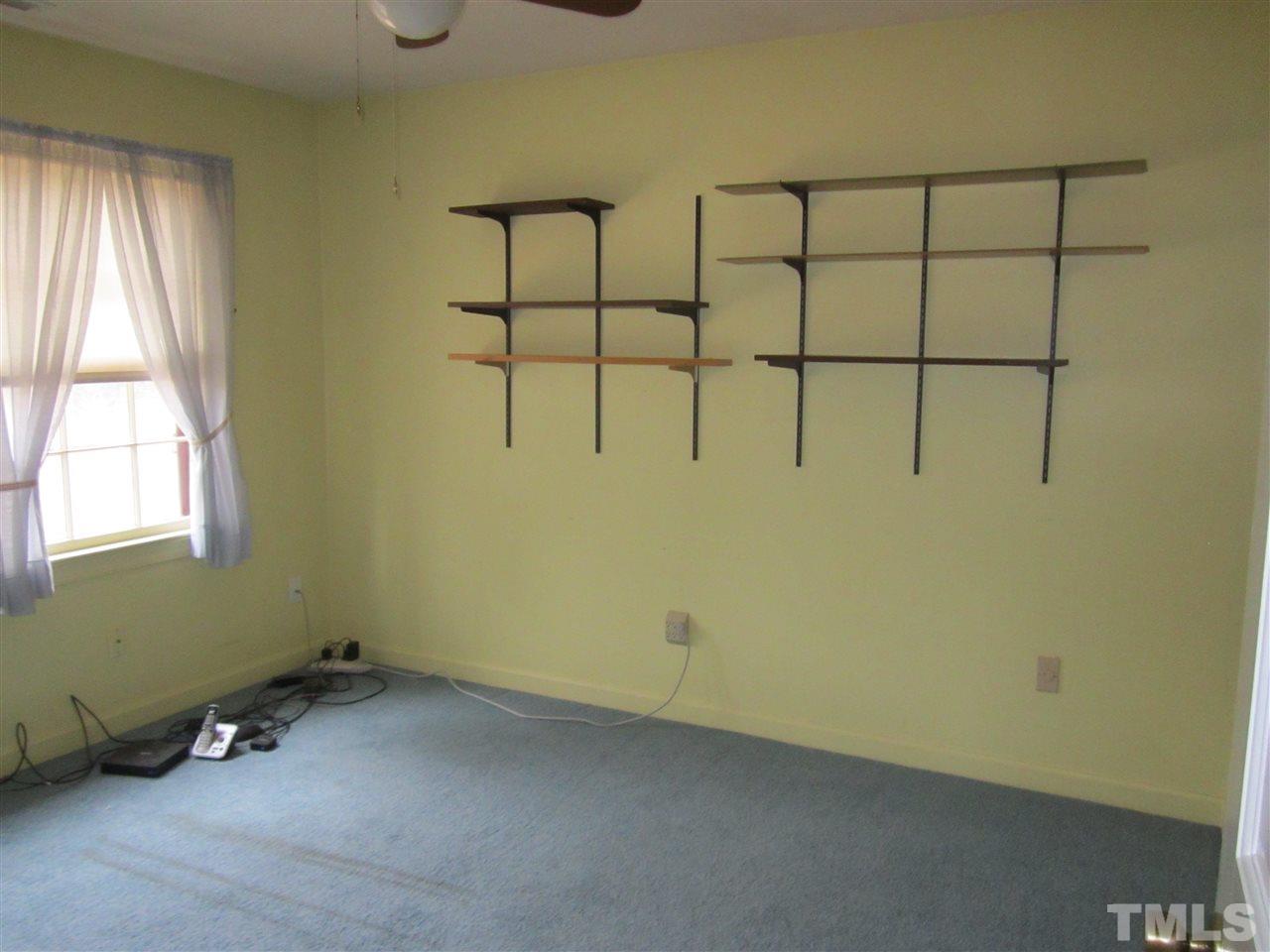 1401 Falls Church Road Raleigh, NC 27609 - Photo 10 of 11 a room with a window