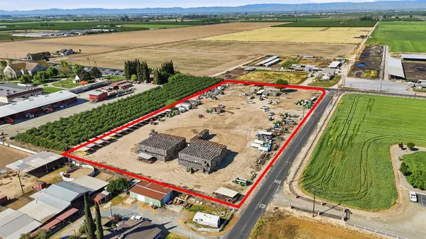 an aerial view of a residential building with an ocean view