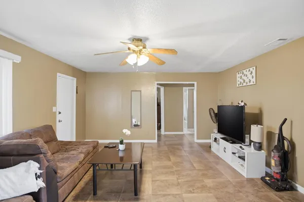 a kitchen with stainless steel appliances a refrigerator sink and microwave