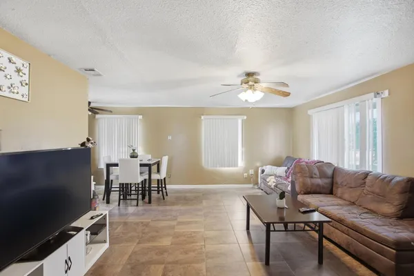 a kitchen with granite countertop a sink stainless steel appliances and cabinets