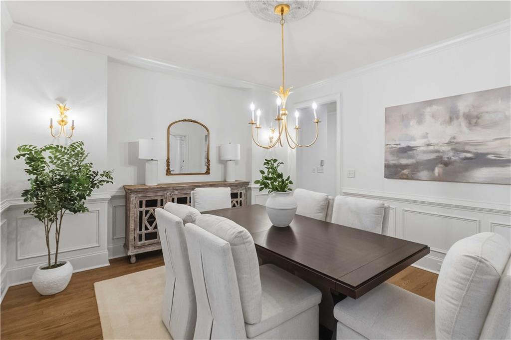 107 Smith Forest Lane Alpharetta, GA 30004 - Photo 5 of 29 a living room with furniture potted plant and a chandelier