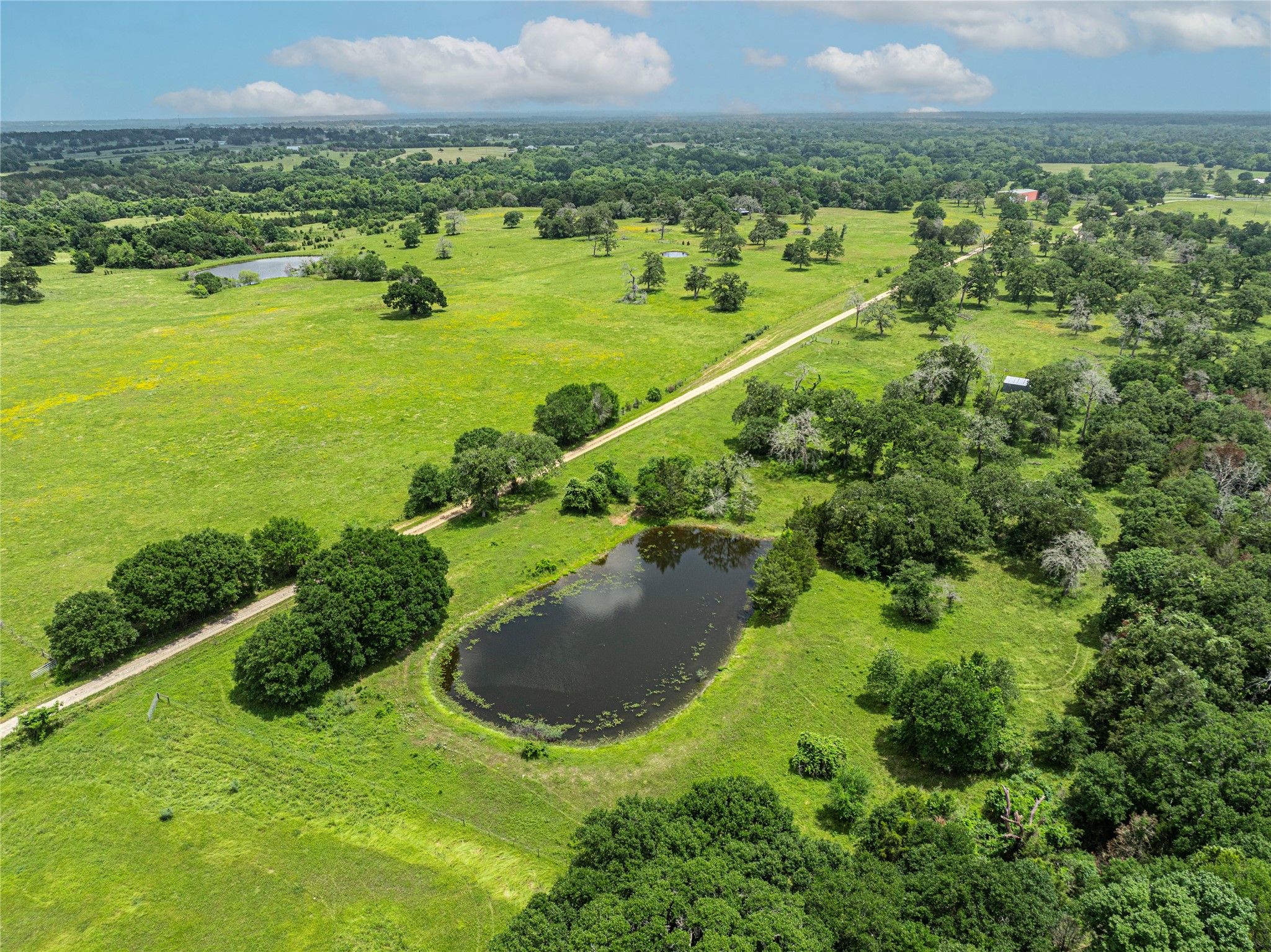 Lot 2 Mill Creek Ranch Road Bellville, TX 77418 - Photo 10 of 11 a view of a lake with a city