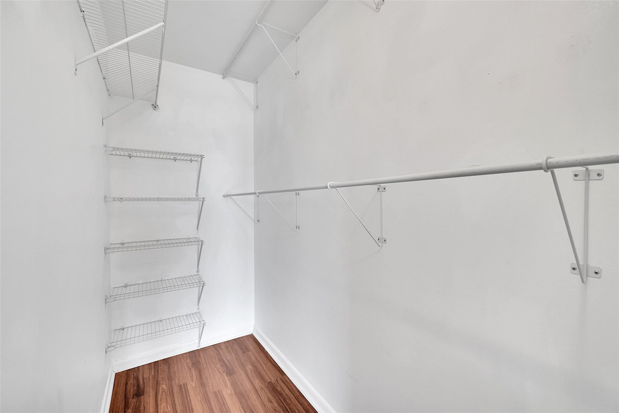 486 Fanshaw L, Unit 486 Boca Raton, FL 33434 - Photo 28 of 44 Walk in Closet w wood flooring