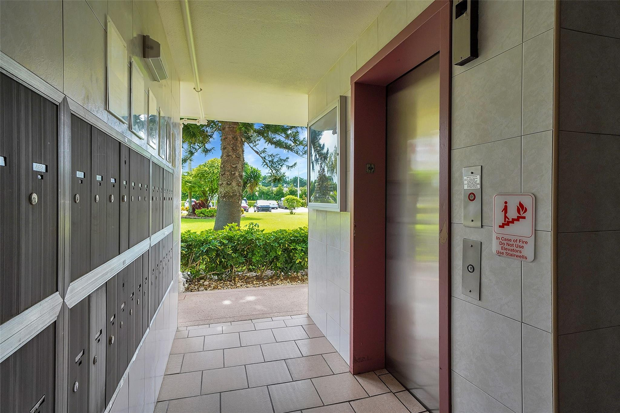 486 Fanshaw L, Unit 486 Boca Raton, FL 33434 - Photo 31 of 44 Elevator and Mailbox