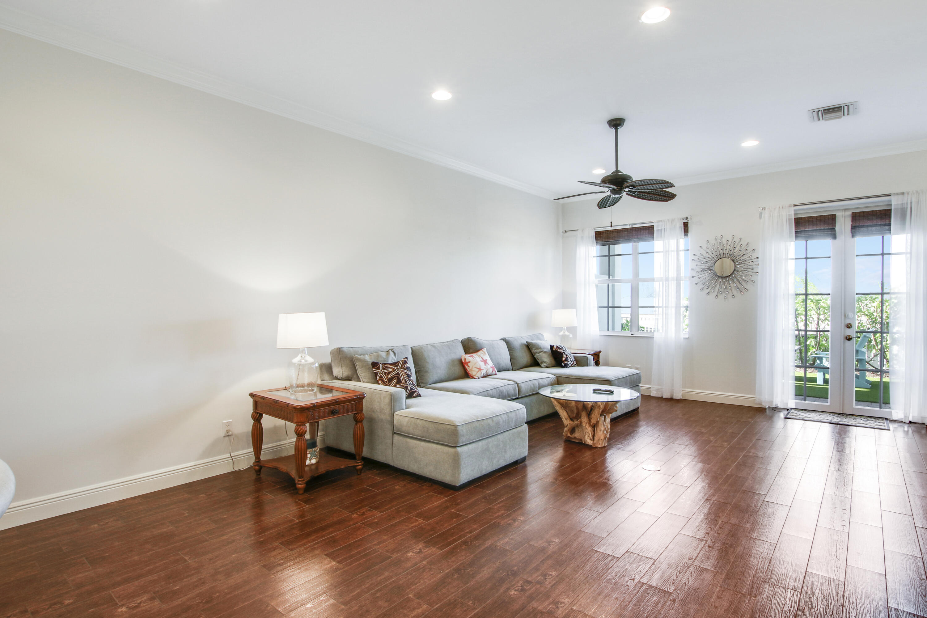 132 Ocean Breeze Drive Juno Beach, FL 33408 - Photo 15 of 33 a living room with furniture and wooden floor