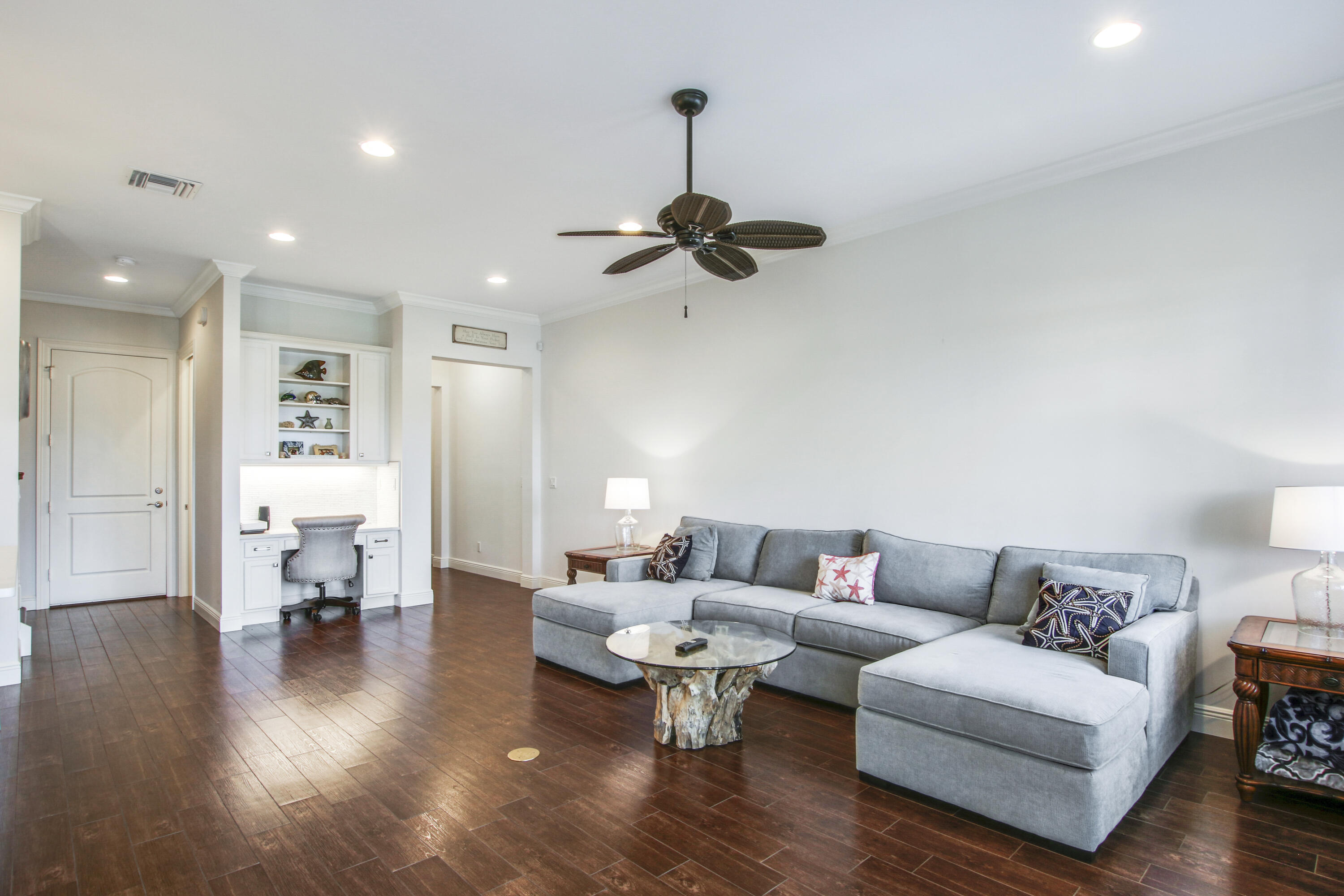 132 Ocean Breeze Drive Juno Beach, FL 33408 - Photo 17 of 33 a living room with furniture and a chandelier