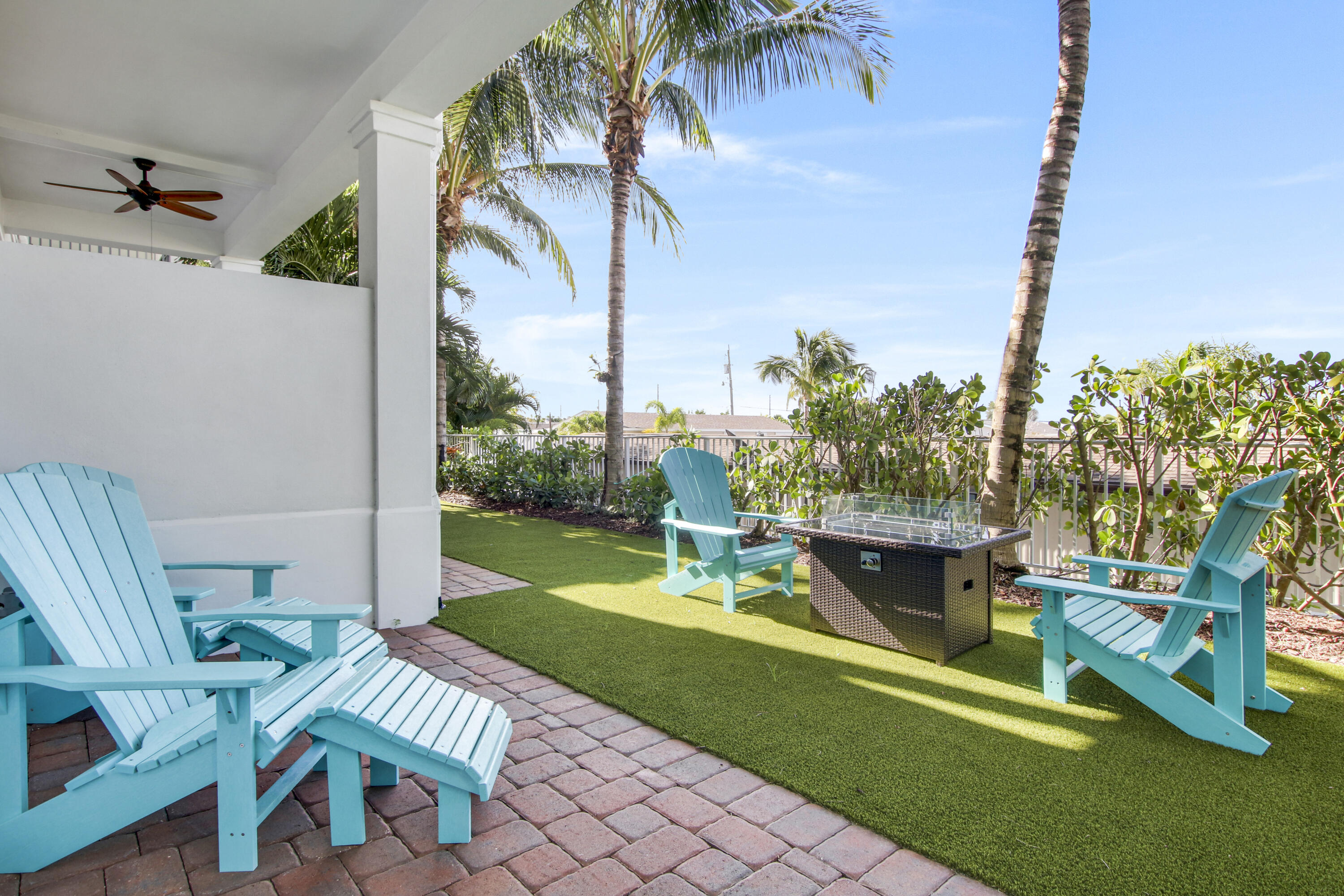 132 Ocean Breeze Drive Juno Beach, FL 33408 - Photo 18 of 33 a view of a chair and table in the garden