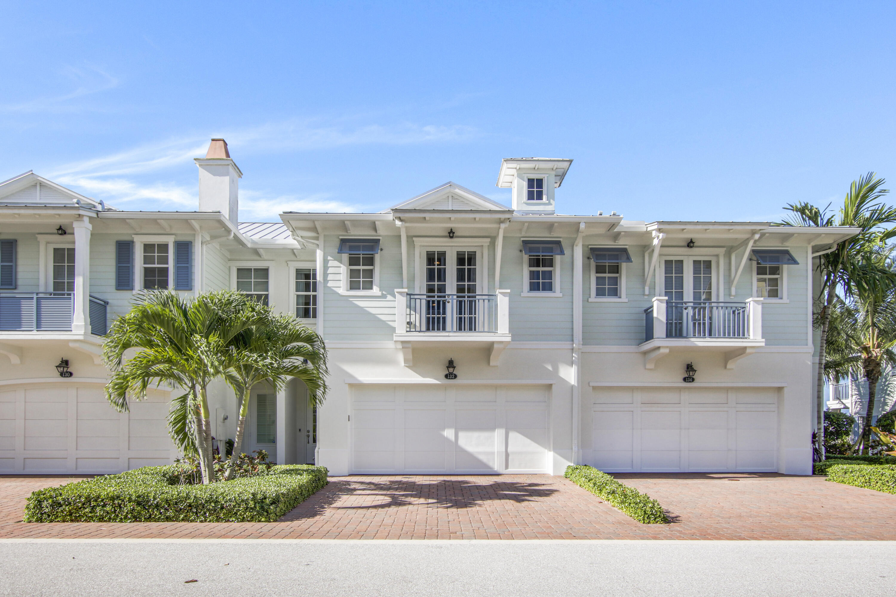 132 Ocean Breeze Drive Juno Beach, FL 33408 - Photo 2 of 33 a front view of a house with porch