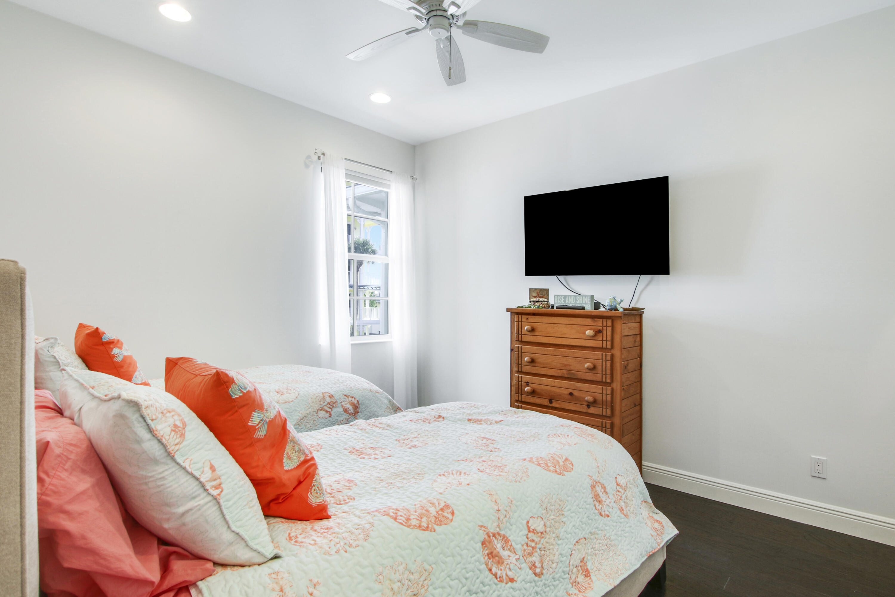 132 Ocean Breeze Drive Juno Beach, FL 33408 - Photo 26 of 33 a bedroom with a bed and a flat screen tv