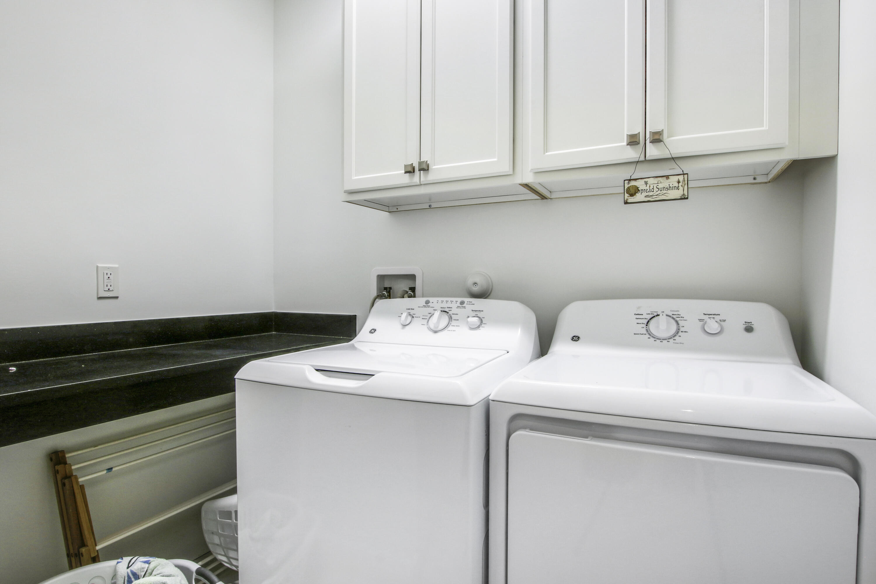 132 Ocean Breeze Drive Juno Beach, FL 33408 - Photo 31 of 33 a utility room with dryer and washer