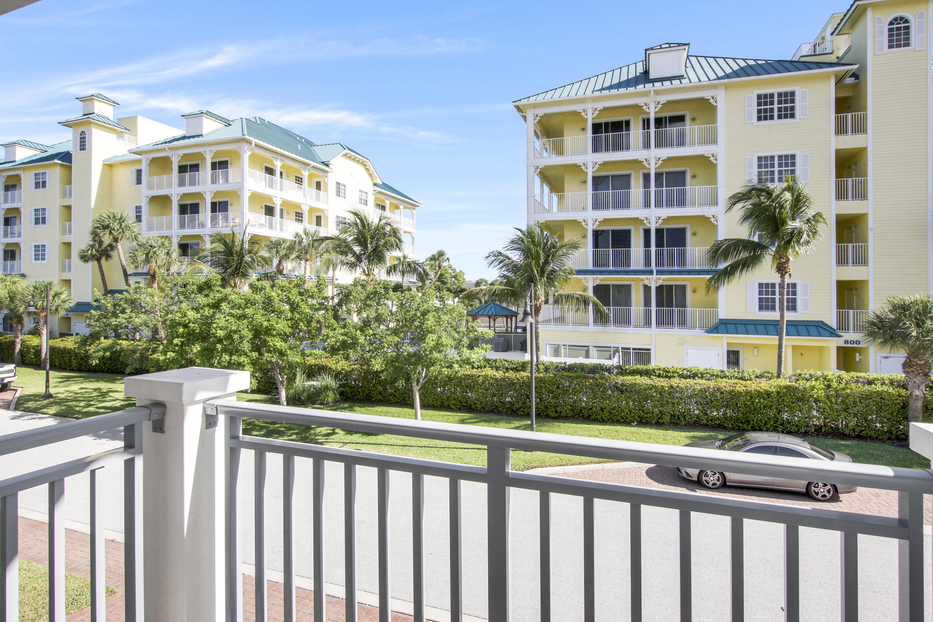 132 Ocean Breeze Drive Juno Beach, FL 33408 - Photo 32 of 33 a view of a building with a yard