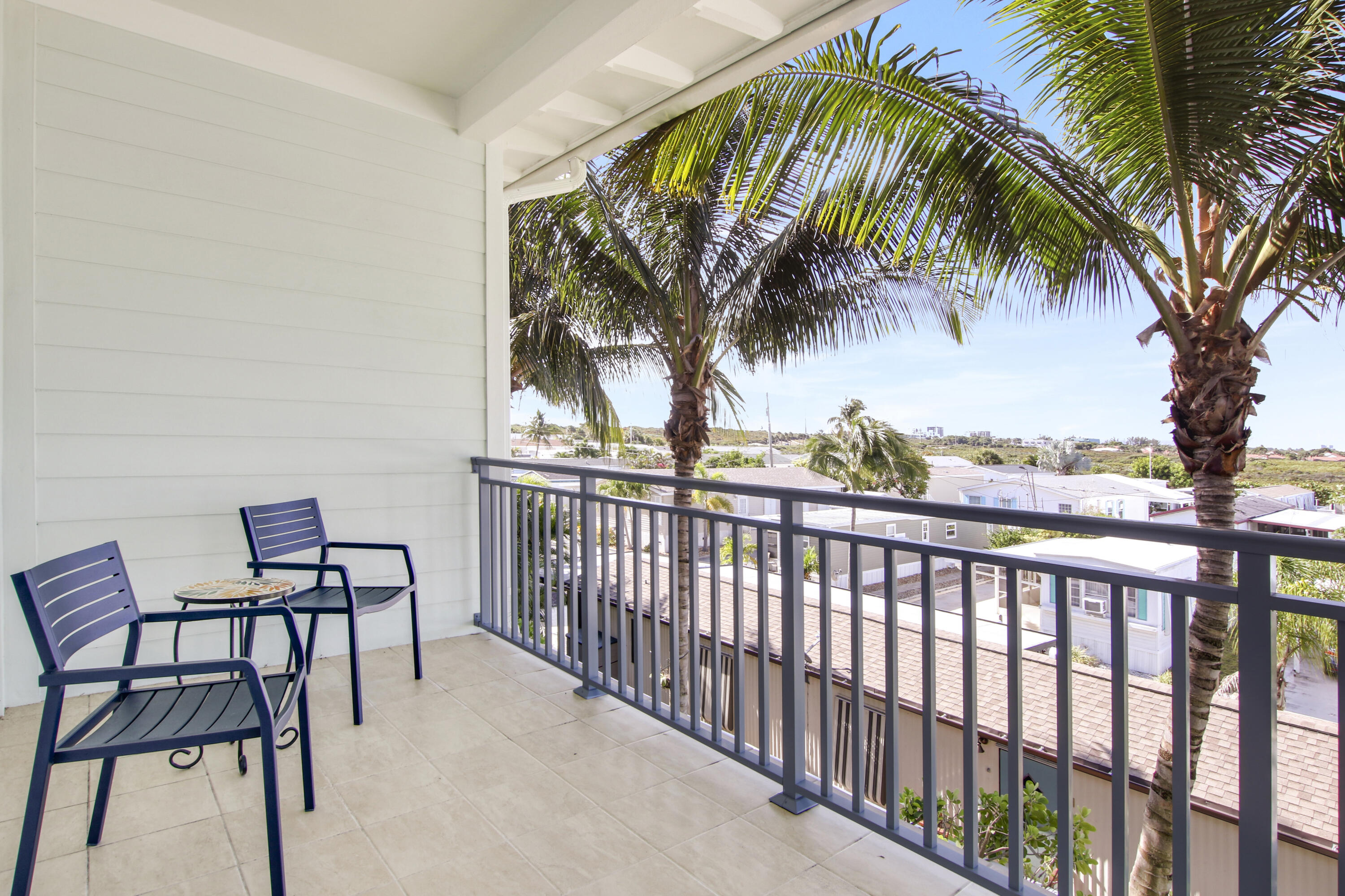 132 Ocean Breeze Drive Juno Beach, FL 33408 - Photo 33 of 33 a view of a chairs and table in patio