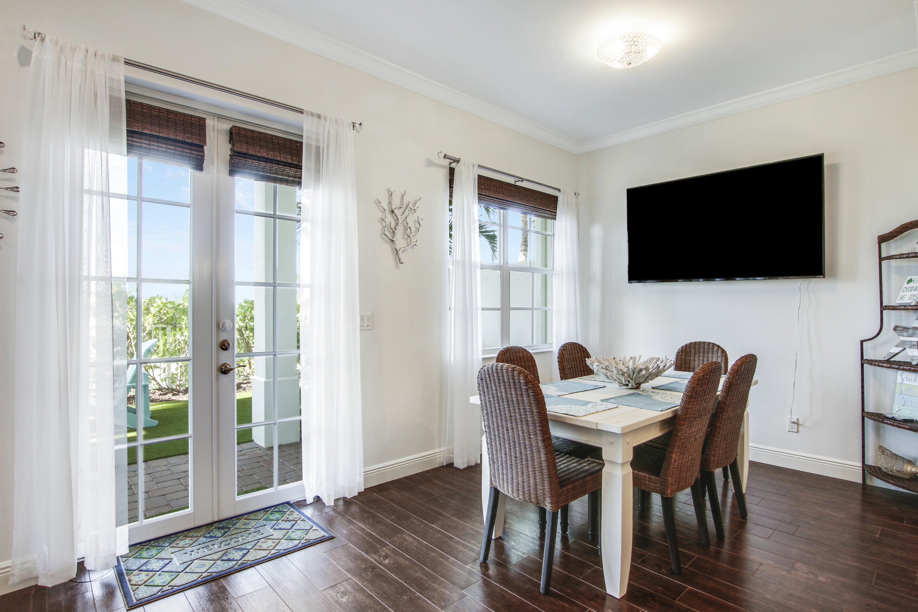 132 Ocean Breeze Drive Juno Beach, FL 33408 - Photo 7 of 33 a view of a dining room with furniture window and wooden floor