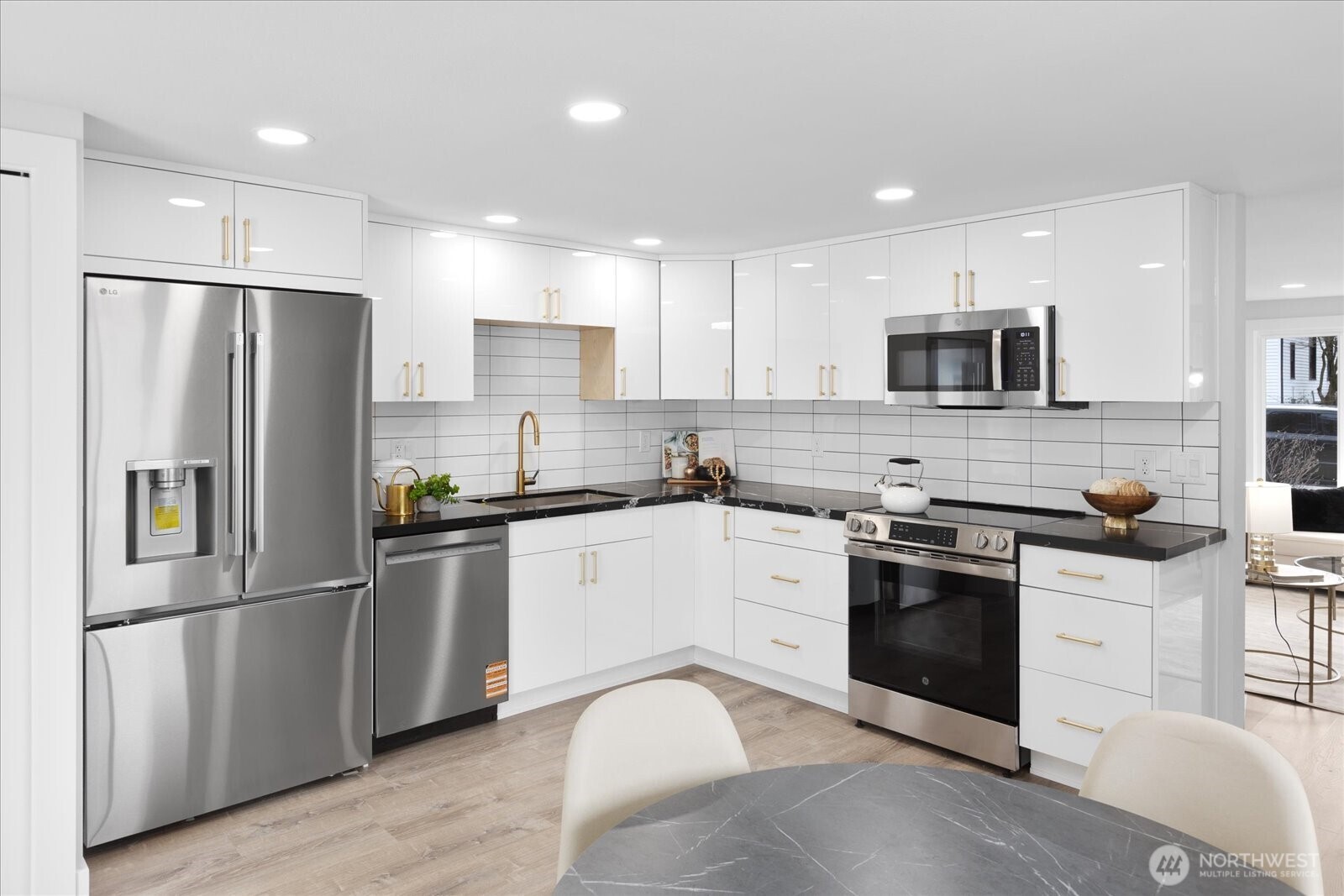 701 Pecks Drive Everett, WA 98203 - Photo 11 of 36 a kitchen with stainless steel appliances granite countertop a refrigerator stove microwave and sink