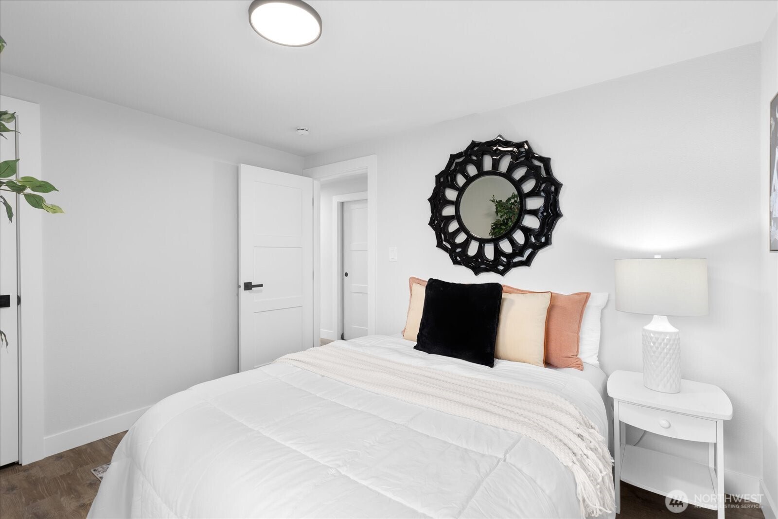 701 Pecks Drive Everett, WA 98203 - Photo 22 of 36 a bedroom with a bed and a chandelier