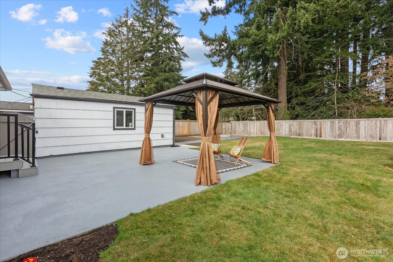 701 Pecks Drive Everett, WA 98203 - Photo 27 of 36 a view of a house with backyard and sitting area