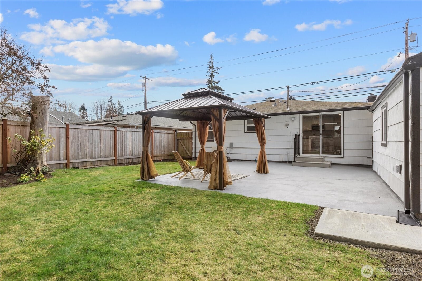 701 Pecks Drive Everett, WA 98203 - Photo 28 of 36 a view of a house with backyard and porch
