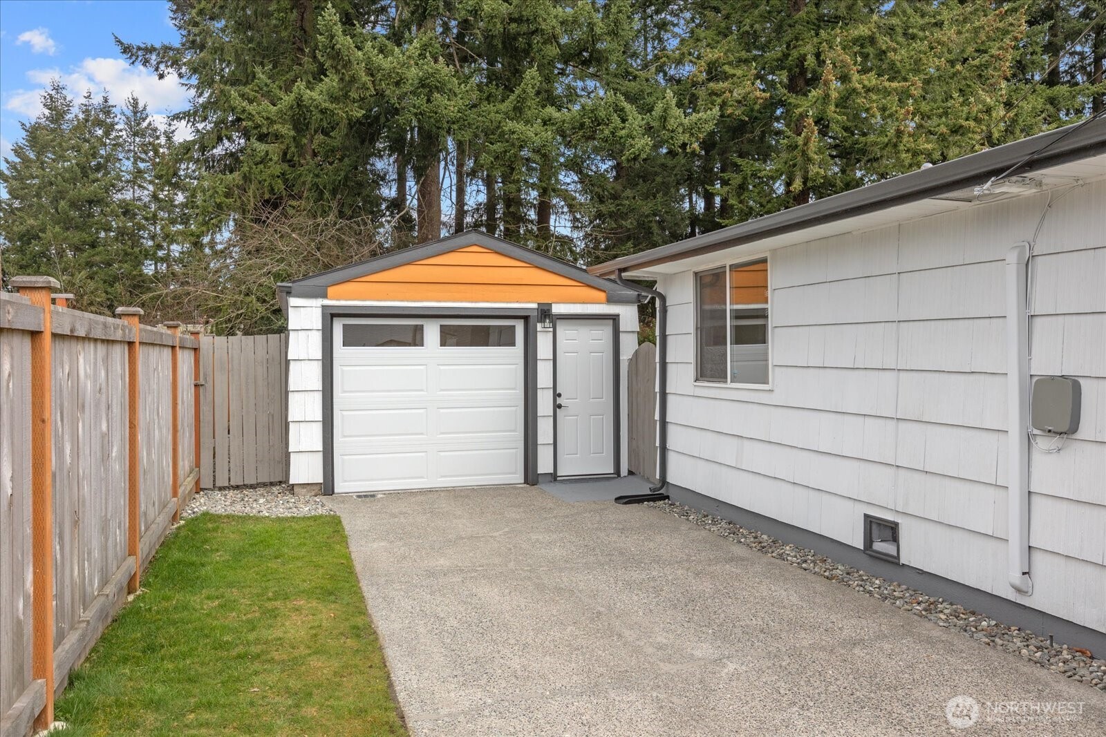 701 Pecks Drive Everett, WA 98203 - Photo 33 of 36 a front view of a house with a yard and garage