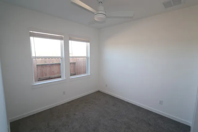 a bathroom with a sink a toilet and a shower