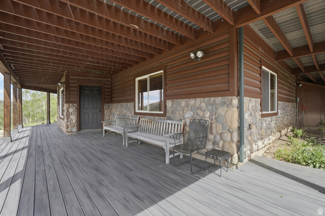 6 Beaver Springs Rancheros Oakley, UT 84055 - Photo 5 of 68 Expansive covered porch featuring gray composite decking